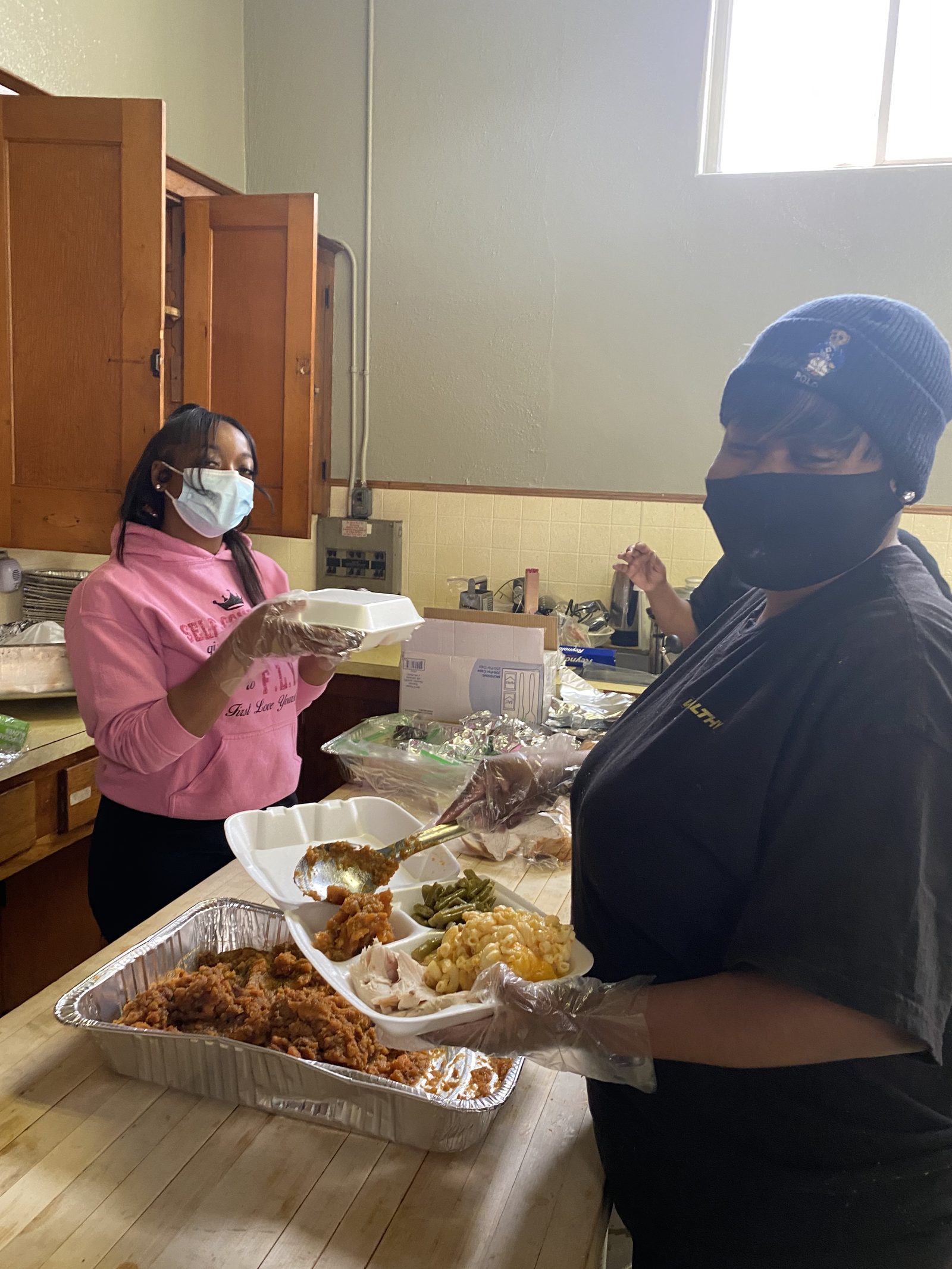 Volunteers serving hot meals to the community