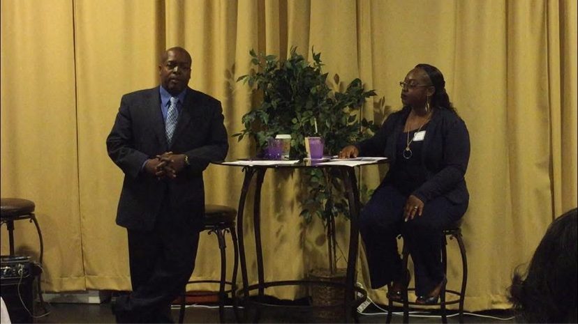 Two speakers lead a family life session at a community gathering