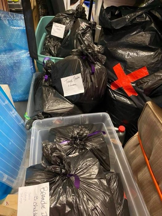Gift bags labeled for individual families.