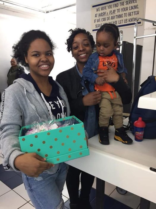 Meeting families where they are — outreach at a local laundromat.