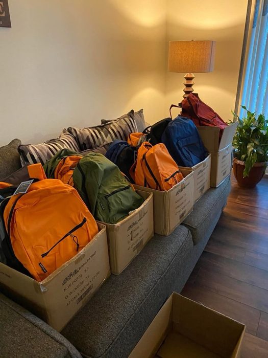 Packed backpacks ready for students.