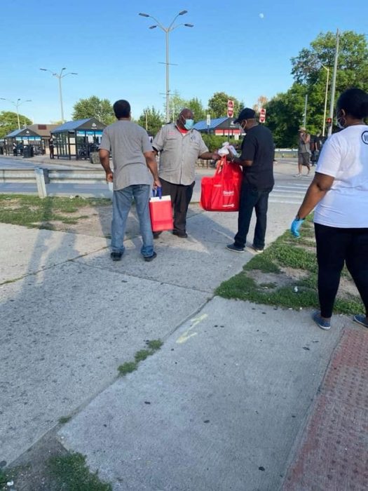 Street outreach — hot meals handed out curbside.