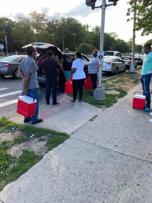 The team unloading coolers for an outreach run.